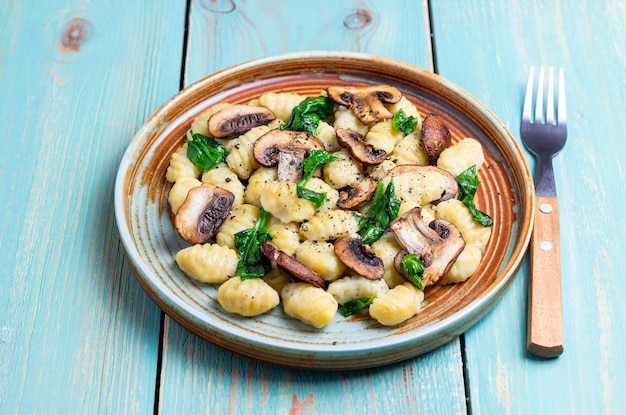 Gnocchi in a creamy sauce with mushrooms and spinach Healthy eating Vegetarian food