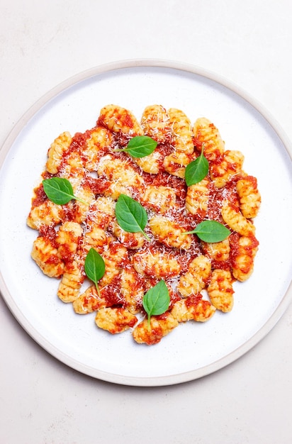 Gnocchi with tomato sauce basil and Parmesan cheese Healthy eating Vegetarian food Diet