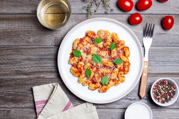 Gnocchi with tomato sauce basil and Parmesan cheese Healthy eating Vegetarian food Diet