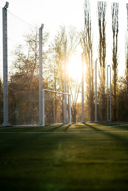 A goal gates on a football field outdoors on a summer day