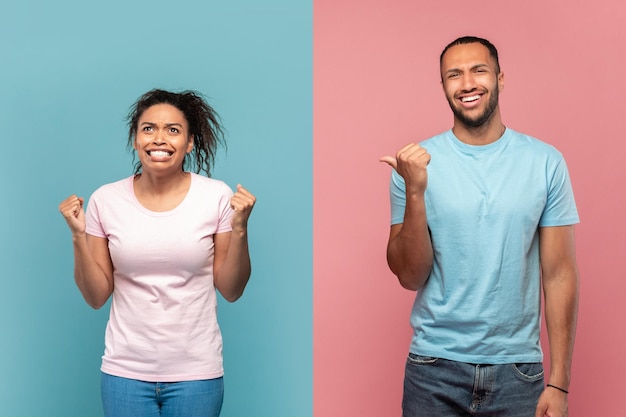 Going mad Laughing african american guy pointing at his screaming crazy girlfriend blue and pink background