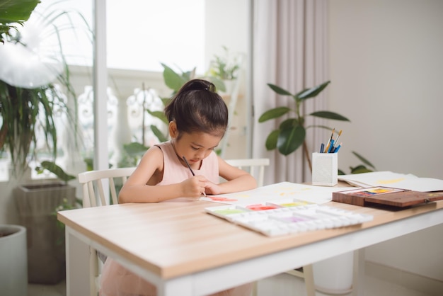 Going to school is your future Education learning teaching a young girl coloring a picture