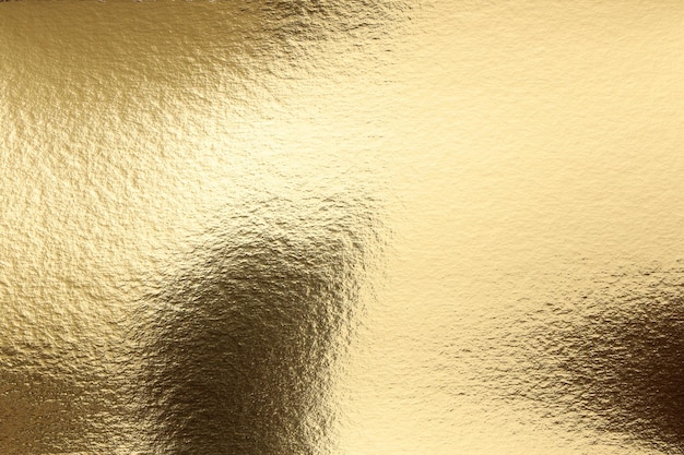 A gold background with a textured surface and a black background.