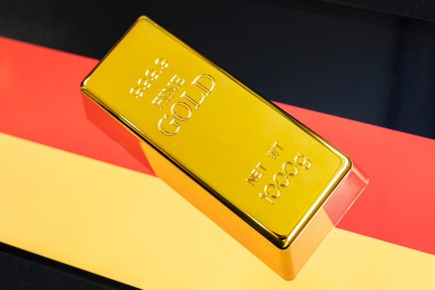 Gold bar is on the national flag of germany german Gold Reserve concept