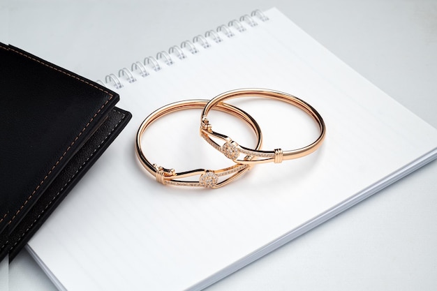 Gold bracelet on the white office desk