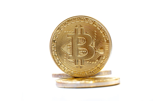 Gold coins bitcoin on white