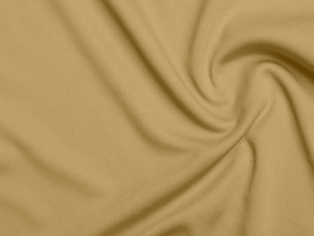 Gold color velvet fabric texture used as background blond color fabric background of soft and smooth