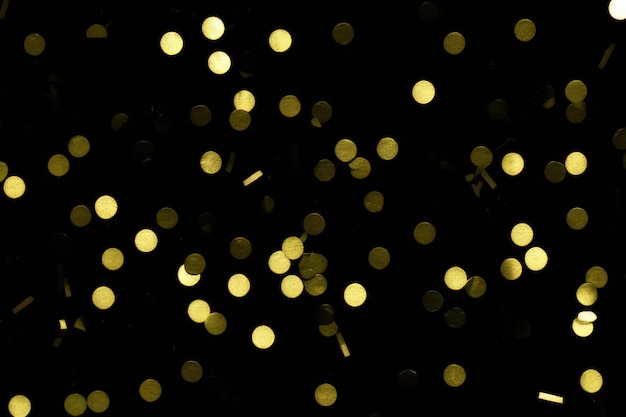 Gold confetti on black background