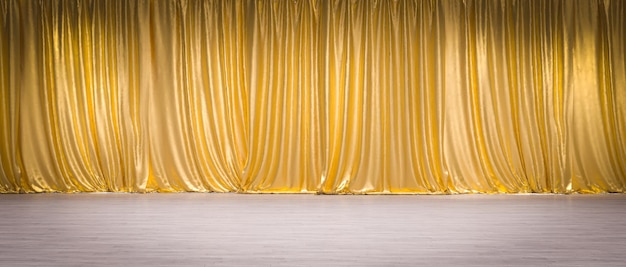 Gold curtains on light wooden floor