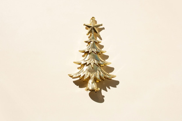 Gold decorative christmas tree on white background