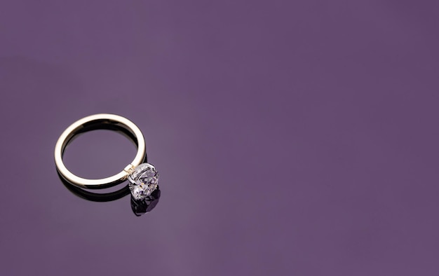 Gold Diamond Ring on Purple Background