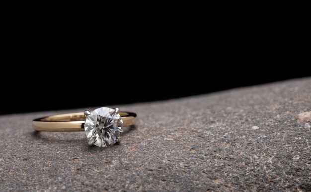 Gold Engagement Diamond Ring on Natural Stone