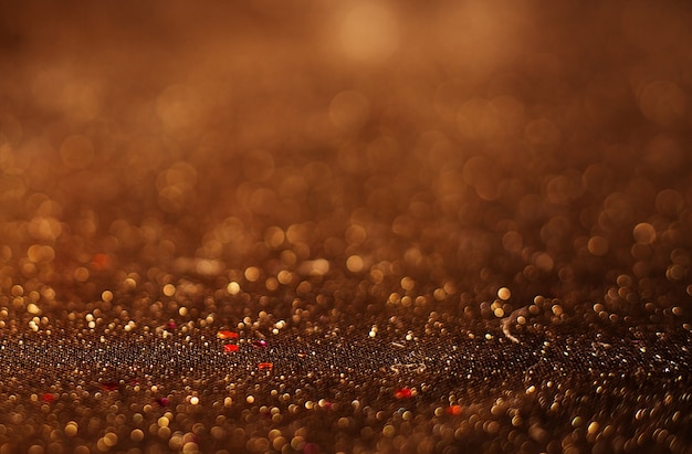 Gold Festive Christmas background. Elegant abstract background with bokeh defocused lights and stars.