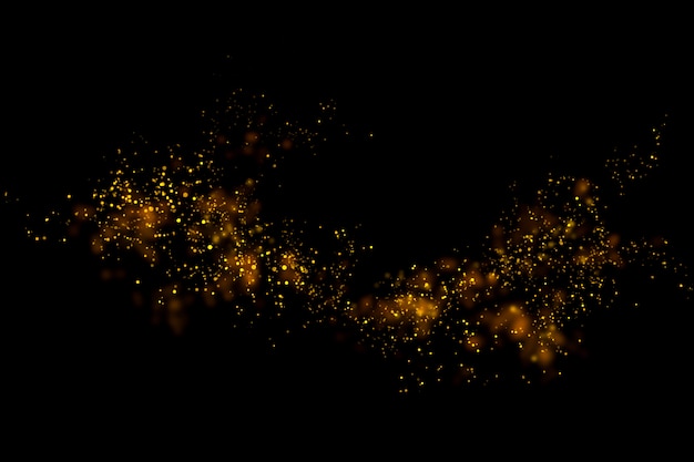 Gold glitter particles lights and bokeh on a black background.