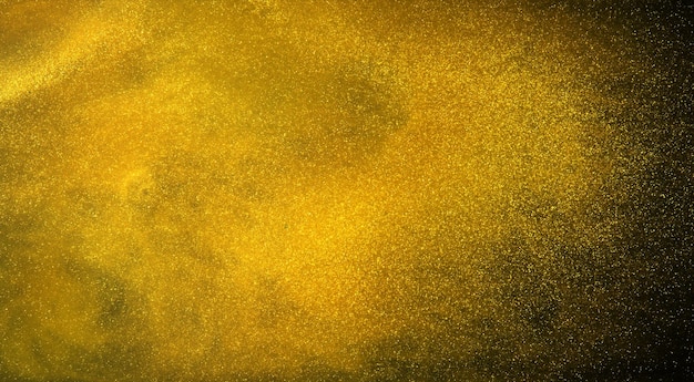 Gold glitter texture on black background