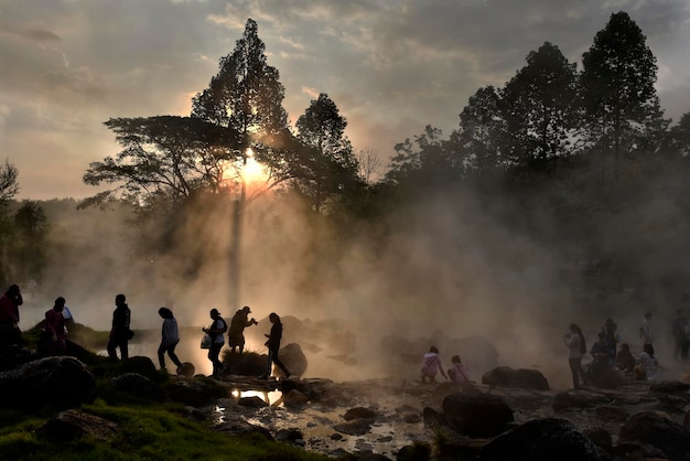 Gold light ray form hot spring fog in a morning Thailand