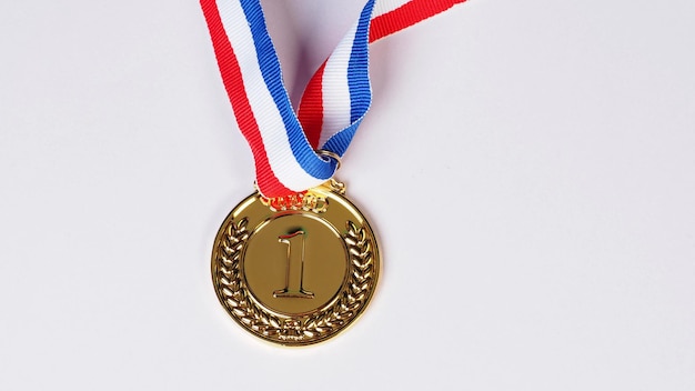 Gold medal on white background