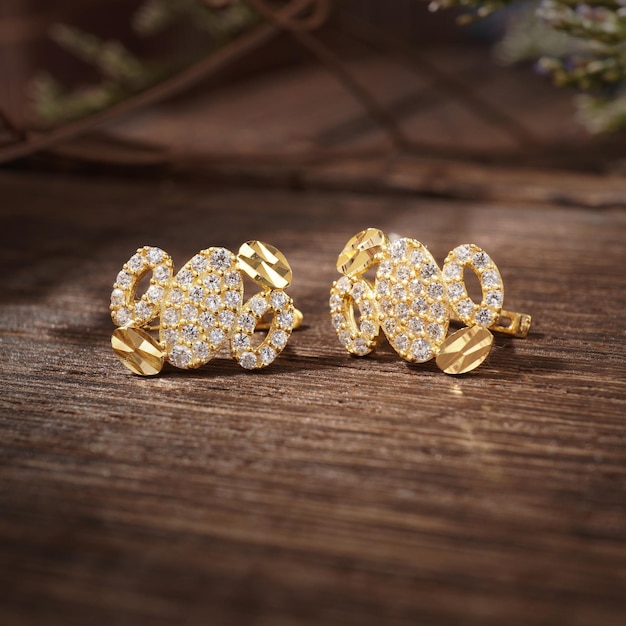 Gold Pierced Earrings on background wood