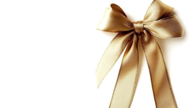 Photo a gold ribbon with a bow on it is tied white background