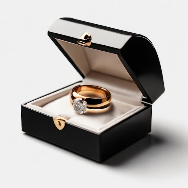 Photo a gold ring in a box with two rings in it