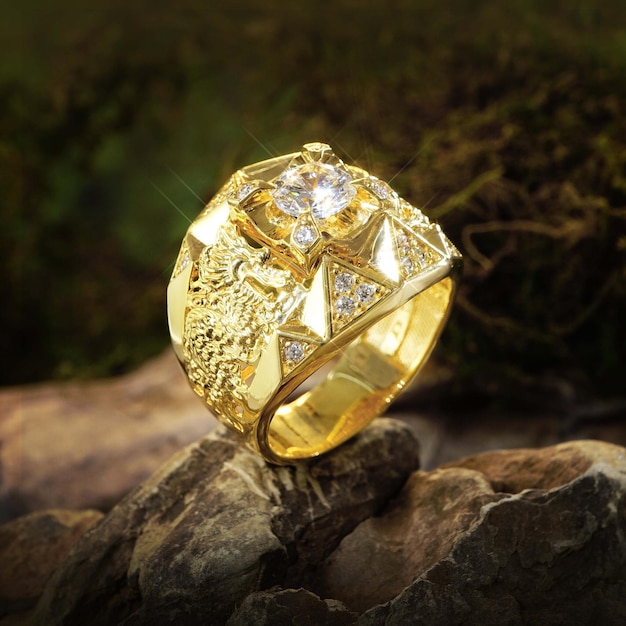 Gold ring men with diamonds, cubic Zirconia, emeralds, and precious stones on background rock moss