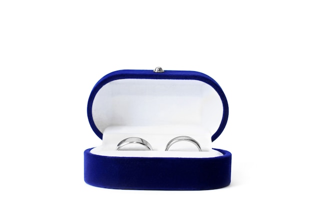 Gold rings in a casket on a white background. White gold