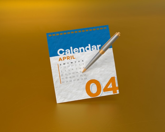 Gold and silver pen with april month calendar paper floating on yellow backdrop