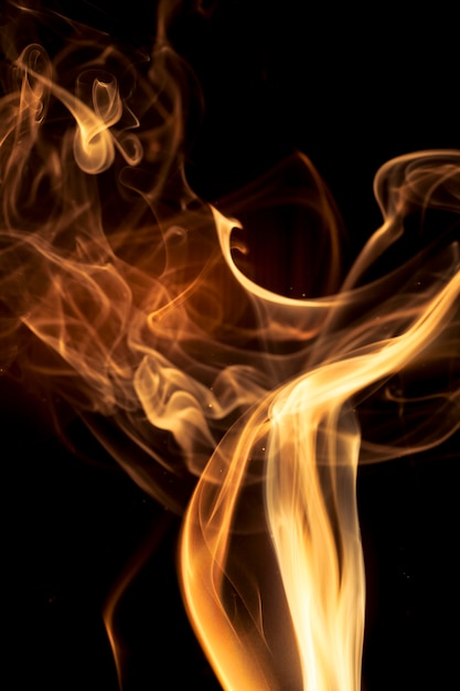 Gold smoke on black background.