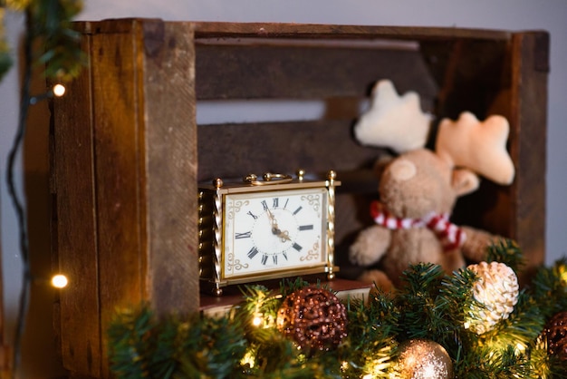 Gold Watch is on Shelf Closeup Soft Toy Deer Sits in Drawer Christmas Decor Interior Closeup