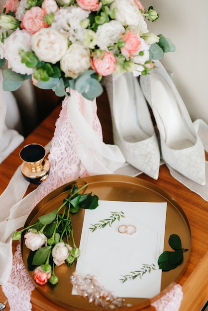 Gold wedding rings as an attribute of a young couple's wedding