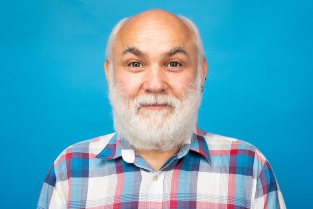 Golden age grandfather mature man close up face of handsome elder senior in studio