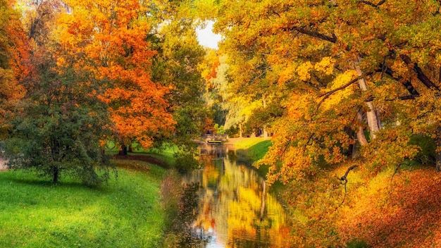 Golden autumn in Catherine Park Tsarskoye Selo Old city park with bright autumn golden maples on a sunny day Panoramic view