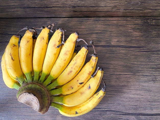 Golden Banana ready to eat on the wooden table