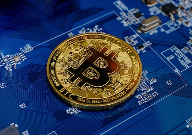 Golden bitcoin cryptocurrency new version on computer electronic circuit board backgroundxA