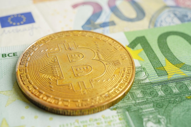 Golden bitcoin on Euro banknotes money for business and commercial, Digital currency, Virtual cryptocurrency.