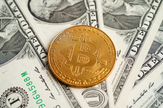 Golden bitcoin on US dollar banknotes money for business and commercial Digital currency