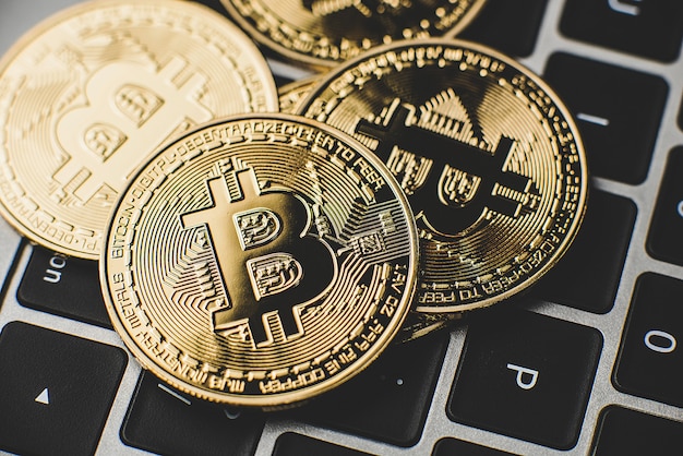 golden bitcoins on laptop keyboard