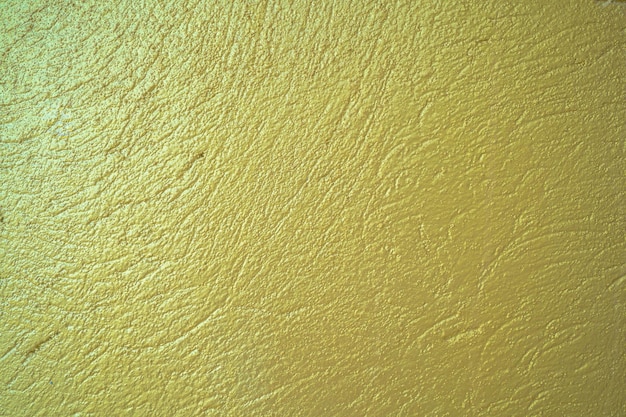 Golden cement texture background Golden cement texture for background abstract design Gold metal brushed background or texture of brushed steel