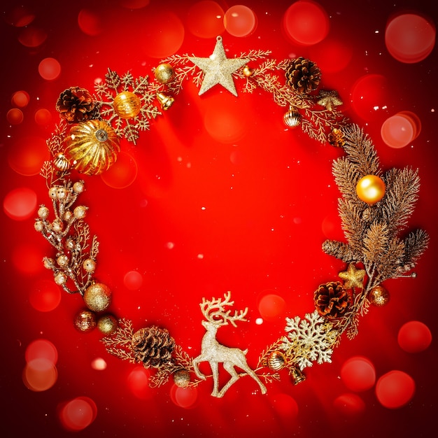 Golden christmas decorations on a bright red background