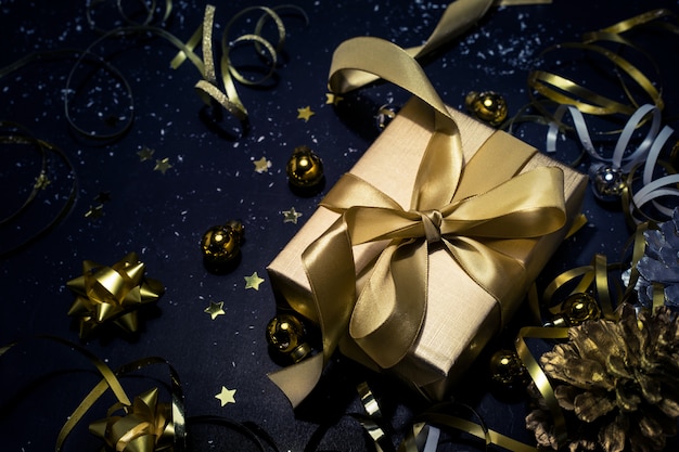 Golden Christmas decorations on dark table