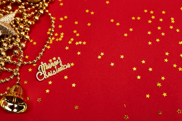 Golden christmas decorations on red background. Christmas New year or party banner