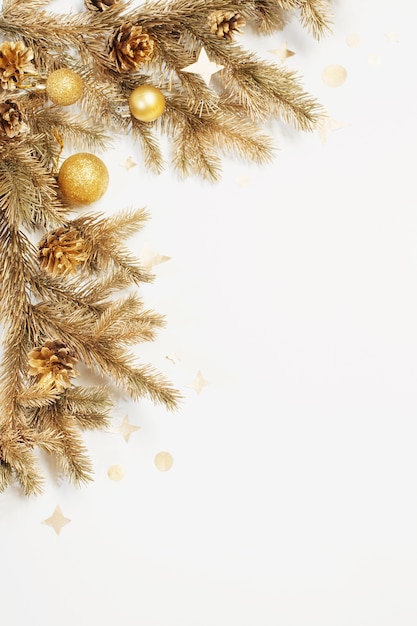 Golden Christmas decorations on white background