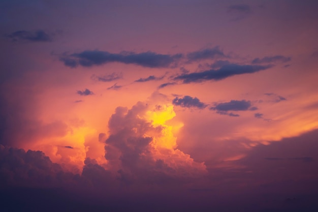 Golden clouds in dramatic light at sunset/sunrise