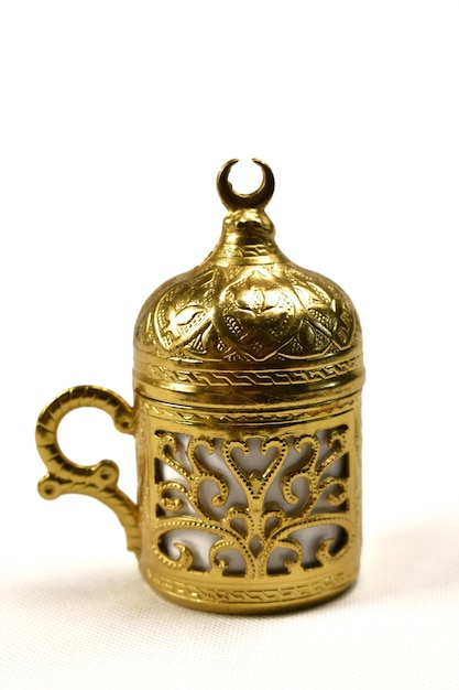 Golden coffee cup on a white background