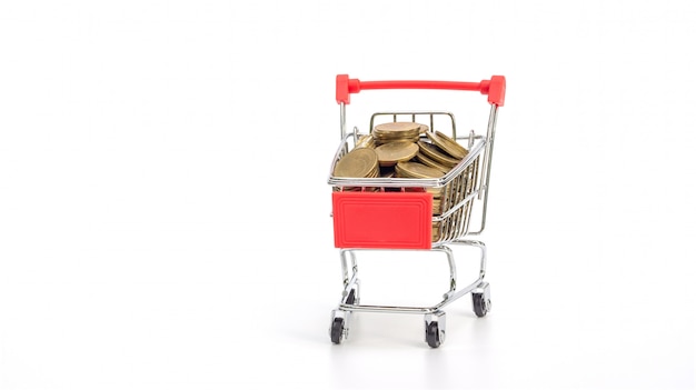 Golden coin in a shopping cart on white 