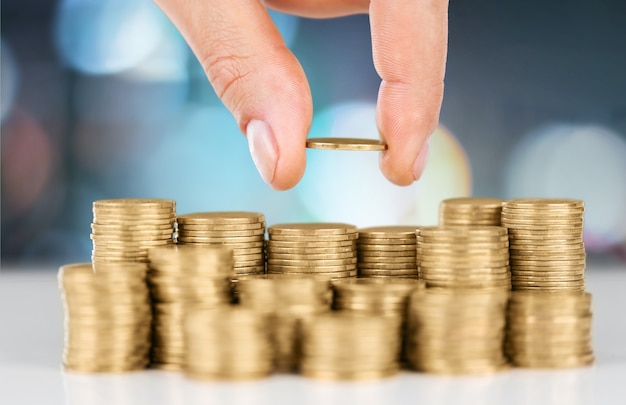 Golden coins stacks on a  background