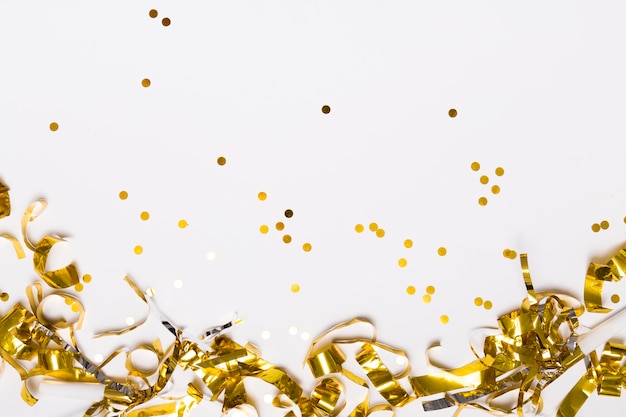 Golden confetti on white