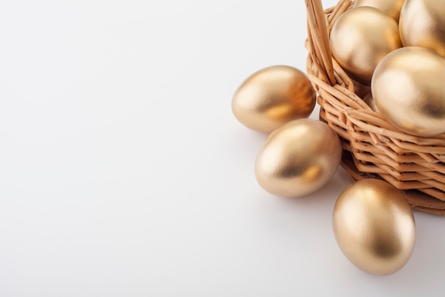 Golden eggs in a straw basket