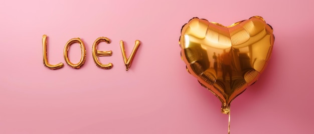 Golden foil balloon in shape of the word LOVE on a Pink background Valentines day concept