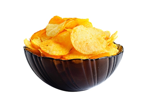 Golden fresh chips in glass bowl, on white